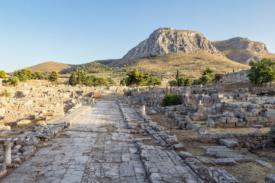 Archaeological site with Lechaion street and view on Acrocorinth, Corinth, Greece