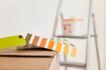 Colour sample on cardboard box in an empty room