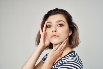 pretty woman in a striped T-shirt Red skirt modern style hairstyle