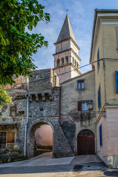 Town gate and Romanesque church St. Rok in Pican, Istria, Croatia