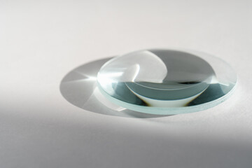 Transparent crystal lens on a white background.