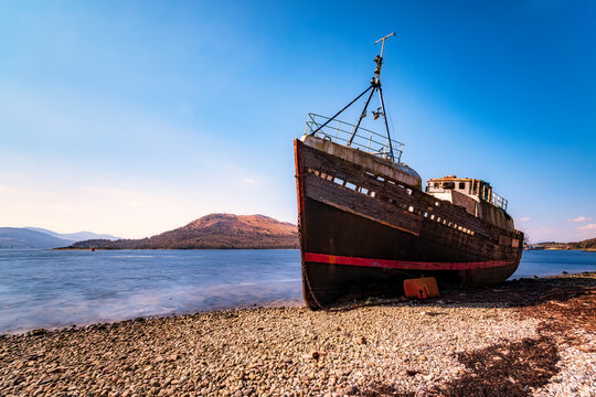 Shipwreck against blue sky at Loch Linnhe, Highlands, Scotland, UK