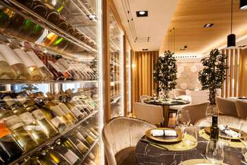 Interior of a fancy restaurant with wine cabinet