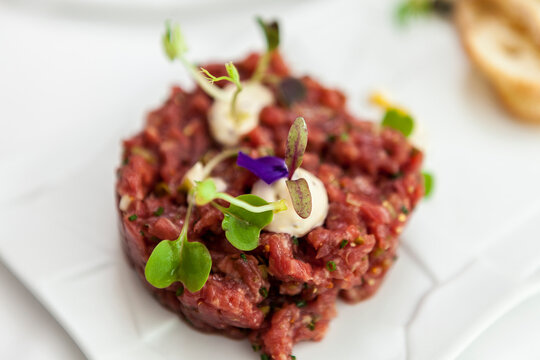 Steak tartar on white plate