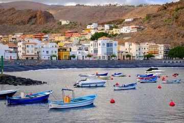 Fotobehang Canarische Eilanden View of "Playa de Santiago" port and behind the neighborhood with the same name. La Gomera island (Canary Islands, Spain)