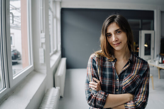 Portrait of young freelancer in a loft