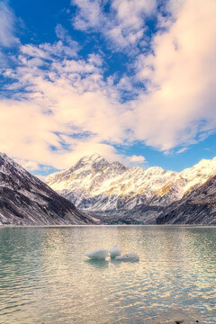 New Zealand, South Island, Scenic view of Clouds over Hooker Lake with Mount Cook and Hooker Glacier in background
