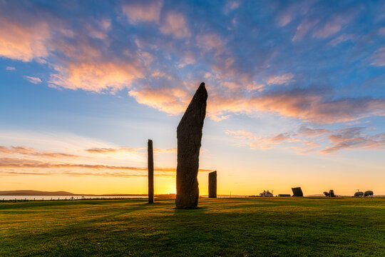 UK, Scotland, Mainland, Clouds over Standing Stones of Stenness at moody sunset