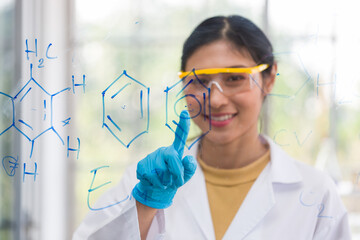 Asian female scientists doing chemistry scientific formula and analysis biochemistry structure in the laboratory. Female specialist working at lab. Woman researcher at laboratory