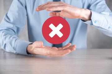 Hand holds icon,cancellation symbol,cancel icon.Cross mark flat red icon.round X mark.cancel...
