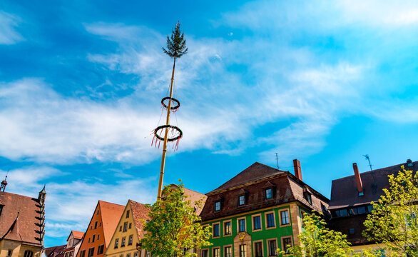 Historic architecture with traditional maypole in Weissenburg, Bavaria, Germany