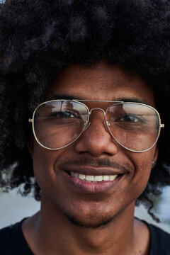 Portrait of young smiling man wearing glasses