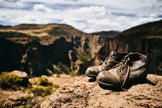 Old hiking boots on top of a hill at Maletsunyane Falls, Lesotho