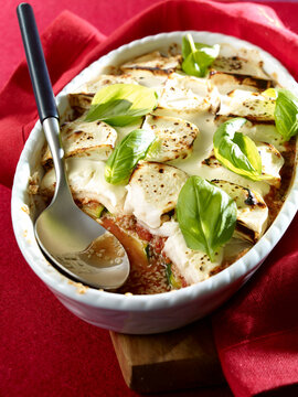 Courgette gratin with goat cheese, sesame in gratin dish, low carb