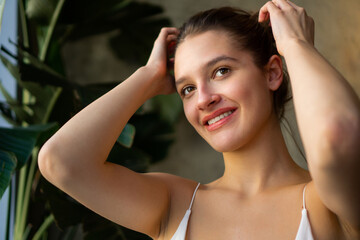 Close-up portrait of a beautiful young caucasian woman with natural brown hair.