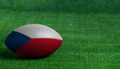 Plakat American football ball with Czech Republic flag on green grass background, close up