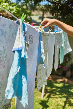 Man hanging up laundry outdoors
