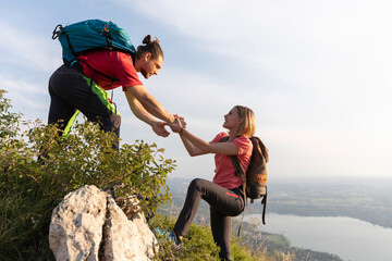 Young couple hiking in mountain meadow