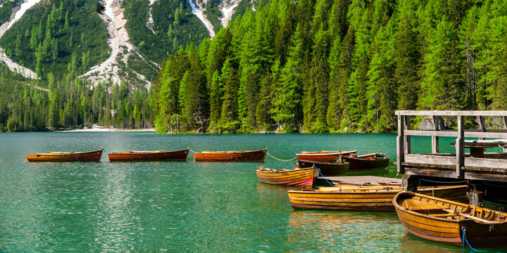 Row of rowing boats on Pragser Wildsee, Braies Dolomites, Alto Adige, Italy