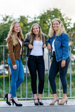 Group picture of three blond young women