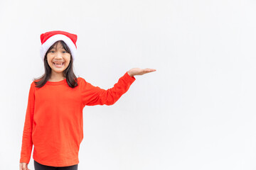 Fototapeta na wymiar Asian little girl in red Santa hat on white background.