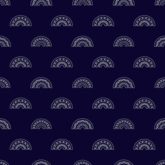 Seamless pattern with white linear rainbows on a dark blue background. Cute vector illustration in ethnic style for kids and women. Doodle style image. The print is suitable for fabric, clothing