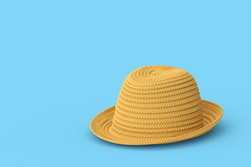Vintage straw beach sun hat isolated on blue background and sun protection