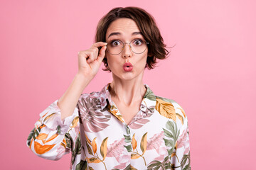 Photo portrait pretty girl whistling surprised wearing printed shirt glasses isolated pastel pink...