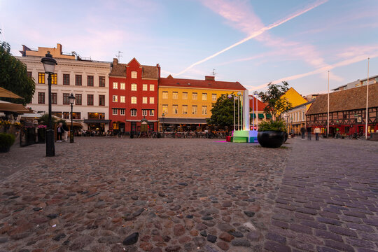 Buildings at city square against sky during sunset in Malmo, Sweden
