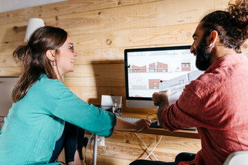 Young architects couple working at home