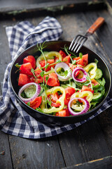 fresh salad vegetable tomato, cucumber, pepper, onion, olive oil healthy veggie meal snack on the table copy space food background 
