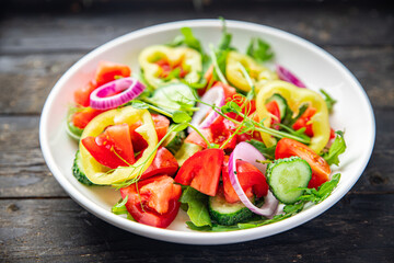 fresh salad vegetable tomato, cucumber, pepper, onion, olive oil healthy veggie meal snack on the table copy space food background 