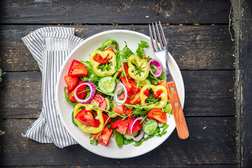 fresh salad vegetable tomato, cucumber, pepper, onion, olive oil healthy veggie meal snack on the table copy space food background 