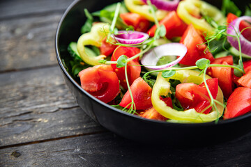 fresh salad vegetable tomato, cucumber, pepper, onion, olive oil healthy veggie meal snack on the table copy space food background 