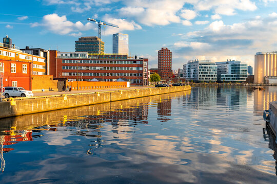 View of canal by Oeresund in city against sky