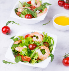 Delicious and healthy shrimp salad with herbs and tomatoes. Dietary nutrition for weight loss. Recipe for cooking fresh seafood. Mediterranean cuisine.