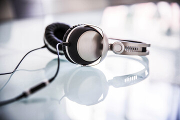 Headphones lying on glass table