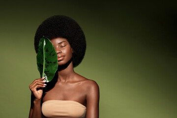 Natural organic cosmetics concept.  Beauty portrait of young beautiful african american woman with...