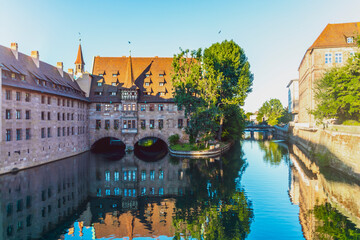 Germany, Nuremberg, Old town, former Hospice of the Holy Spirit and Pegnitz River