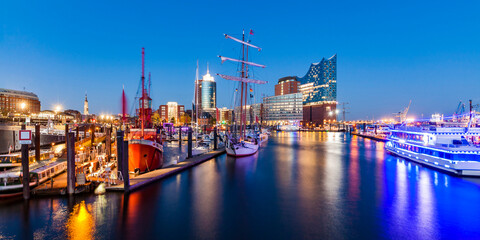 Germany, Hamburg, HafenCity, Elbe Philharmonic Hall and harbor at night