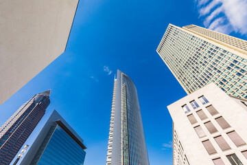 Low angle view of skyscrapers against blue sky, Frankfurt, Hesse, Germany