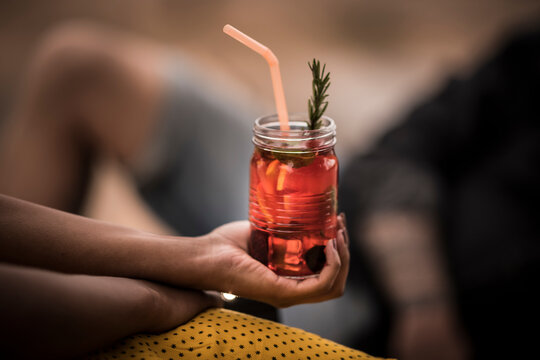 Close-up Of Woman Holding Fresh Ice Tea Drink