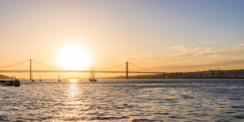 April 25th Bridge over Tagus river against sky during sunset in Lisbon, Portugal