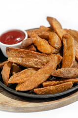spicy curry powder coated crispy deep fried potato wedges