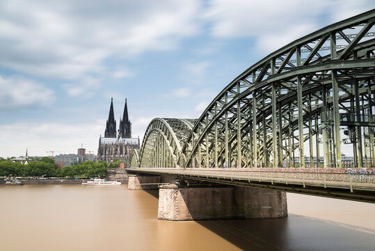 Germany, Cologne, view to Cologne Cathedral with Hohenzollern Bridge and River Rhine in the foreground