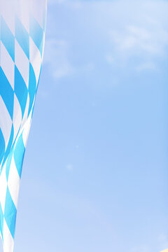 Germany, Bavaria, Munich, Low angle view of Bavarian flag hanging against sky during Oktoberfest