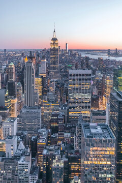 Skyline at sunset with Empire State Building in foreground and One World Trade Center in background, Manhattan, New York City, USA