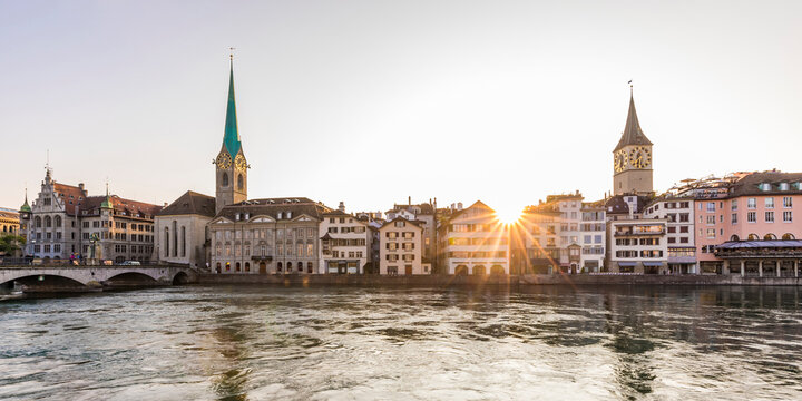 Switzerland, Canton of Zurich, Zurich, River Limmat and old town waterfront buildings at sunset