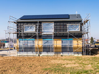 Germany, Baden-Wurttemberg, Waiblingen, Construction site of modern house equipped with solar panels