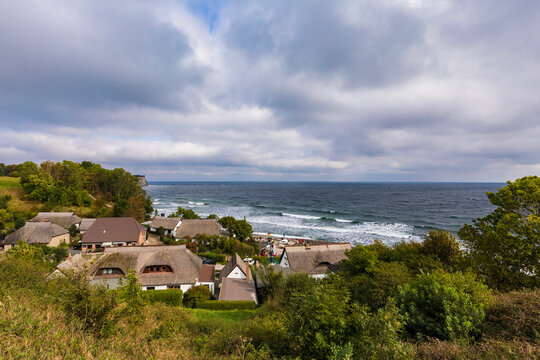 Germany, Mecklenburg-West Pomerania, Ruegen Island, Cape Arkona, Vitt, Village on coast on cloudy day